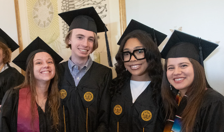 Image of 4 people in graduation attire